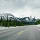Road with snow-capped mountains with trees and landscape in Jasper National Park, Alberta, Canada