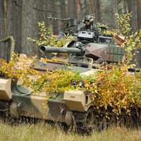 Soldier commands a tank in combat